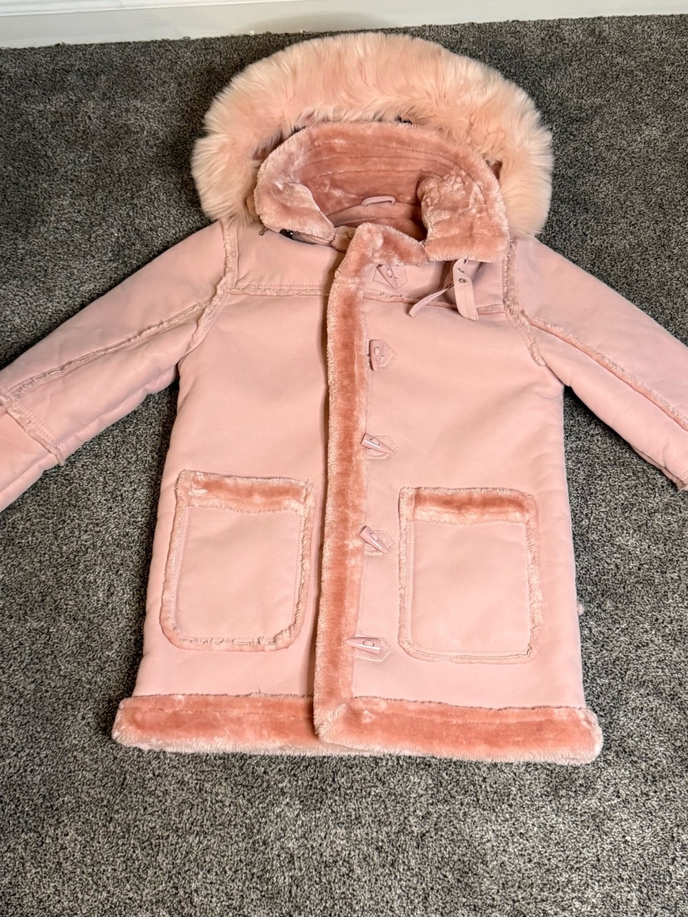 Jordan Craig Kids Denali
Shearling Toggle Coat Pink faux fur coat with hood.
